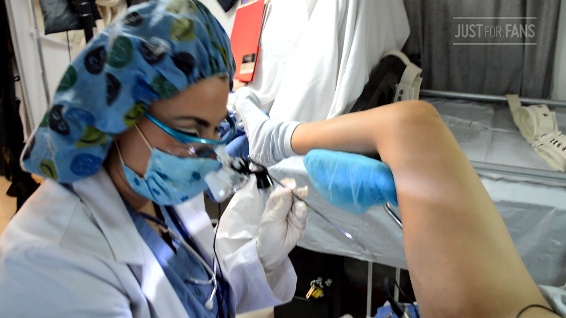 Dr. Miss Mia performing a colposcopy in the Nurse Gypsy free MedFet video from Miami analysed at the Amara Fetish Clinic