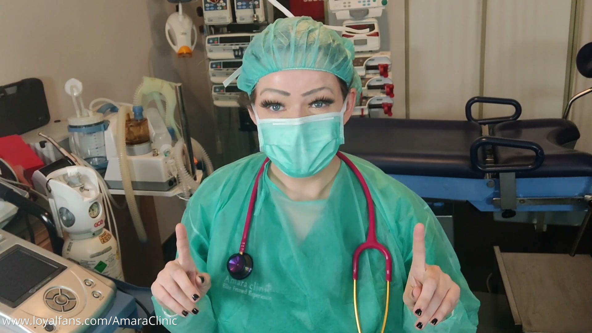 Mistress Katharina Amara taking a patient's heart pressure with a Littmann stethoscope and a Welch Allyn manual pressure meter in her free POV BDSM medical video